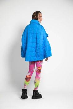 Unisex quilted jacket "Lupinus Blue" features a round shoulder and oversized fit for a relaxed, comfortable feel. It's made from lightweight, wrinkle-free polyester and has large pockets, windproof, and water repellent properties. The soft, bold shape makes it a statement piece, and the hypoallergenic synthetic padding adds warmth without compromising style.Size Guide:ONE SIZE (fits to XS-XL)Collar - 51 cmWides middle line - 170 cmBottom line - 140 cmSleeve ends - 57 cmLength from the neckline t Oversized Quilted Outerwear For Cold Weather, Oversized Blue Windbreaker For Fall, Oversized Blue Outerwear, Blue Nylon Outerwear With Padded Collar, Functional Blue Nylon Puffer Jacket, Oversized Puffer Windbreaker With Long Sleeves, Oversized Quilted Nylon Outerwear, Oversized Functional Puffer Outerwear, Oversized Functional Outerwear For Cold Weather