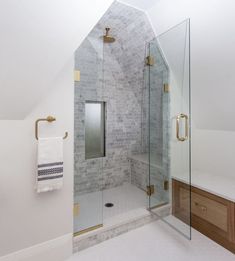 a walk in shower sitting inside of a bathroom