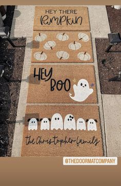 the doormats have ghost faces on them and words that say hey booo