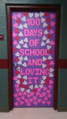 a door decorated with hearts and the words 100 days of school and loving it in pink