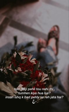 a person laying on the ground with flowers in front of them and a quote written below