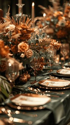 the table is set with gold and silver plates