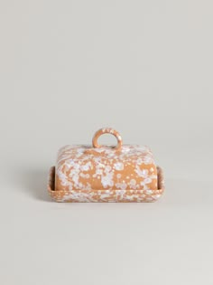 an orange and white box with handles