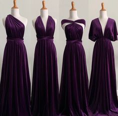 three bridesmaid dresses on mannequins in front of each other, with one wearing a purple dress