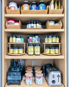 an organized kitchen pantry with coffee and spices