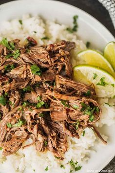 shredded beef and rice with lime wedges on the side