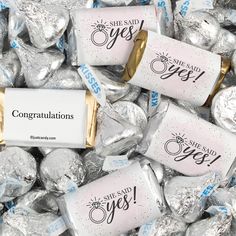 some candy wrapped in foil with congratulations stickers on them