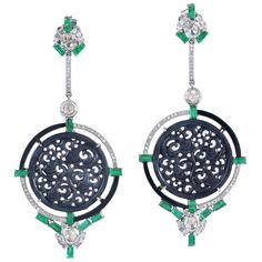 These stunning carved Jade earrings are meticulously crafted from 18 Karat gold and sterling silver. It is hand set in 30.0 carats Jade, 3.13 carats emerald and 2.23 carats of sparkling diamonds. FOLLOW MEGHNA JEWELS storefront to view the latest collection & exclusive pieces. Meghna Jewels is proudly rated as a Top Seller on 1stDibs with 5 star customer reviews. All items manufactured by us are handmade and can be customized or redesigned. Composition Size-80X35 MM Total Weight-24 Gold Weight(Gms)-1.76 Silver Weight(Gms)-13.708 Diamond Wt(Cts)-2.23 Emerald Wt(Cts)-3.13 Jade Wt(Cts)-30 Luxury Carved Earrings, Luxury Carved Earrings For Formal Occasions, Elegant Carved Earrings For Formal Occasions, Elegant Round Carved Earrings, Elegant Carved Round Earrings, Luxury Earrings With Intricate Design, Carved Diamond Fine Jewelry, Fine Carved Diamond Jewelry, Elegant Silver Carved Earrings