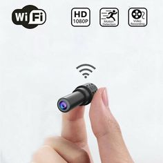 a hand holding a small camera in front of an image of wifi and other icons