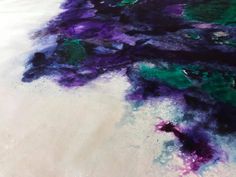 an abstract painting with purple and green colors