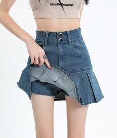 Revisit the cool trends of the late '90s and early '00s with our Y2k Pleated Jean Mini Skort. Combining the best of both worlds, it looks like a skirt but offers the comfort of shorts underneath. Featuring a belt looped waist and twin front pockets, it's a must-have for those nostalgic about Y2K style. Y2k aesthetic Skater skirt Zip & button fastening Dark wash denim material Belt looped waist Cotton, polyester Twin front pockets Skirt with under shorts Dark Academia Dresses, Aesthetic Skater, Jeans Patchwork, Fall Sweaters For Women, Under Shorts, Aesthetic Clothing Stores, Jogger Pants Casual, Streetwear Grunge, Cardigan Sweater Vest