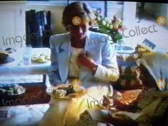 an old photo of a woman sitting in her living room