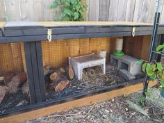 a chicken coop with chickens in it