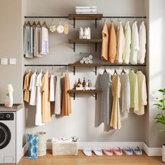 a laundry room with clothes hanging on the wall