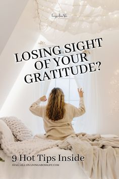 a woman sitting on her bed with the text losing sight of your gratitude?