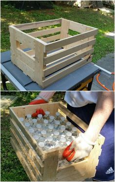 a wooden crate filled with empty water bottles