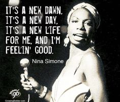 a woman holding a microphone in her right hand and a quote on the left saying it's a new dawn, it's a new day, its a new life, it's a new life, for me, and i'm'm'm'm '