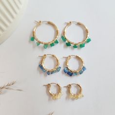 Let's add a POP OF COLOR!  Add some color envy to your ears with the gem wrapped Etta earrings! Handcrafted with raw gemstones, each earring is wrapped in 14K gold-filled or sterling silver wire. Perfect for adding a pop of color to any outfit. Details: -available in sterling silver or 14K yellow gold-filled -small-13mm, medium- 18.7mm, large- 28mm -wire is wrapped and welded to the earring in our studio so it will not unwrap -handmade in Brownsburg, Indiana Handmade Blue Huggie Hoop Earrings, Handmade Hoop Earrings For Birthday, Ring Spacer, Hoop Charms, Earrings Colorful, Birthstone Earrings, Layered Chains, Birthstone Earring, Raw Gemstones