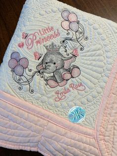 a baby blanket with an elephant and balloons on it that says little princess in pink