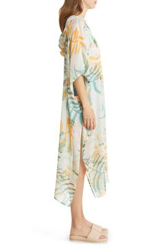 Layer up your look in airy style with this longline caftan complete with a fixed hood. 46" length (size O/S) Fixed hood Elbow-length sleeves 100% polyester Hand wash, line dry Imported Casual Long Printed Cover-up, Breezy Spring Kaftan, Casual Spring Daywear Kaftan, Casual Tunic Cover-up For Daywear, Casual Daywear Tunic Cover-up, Spring Daywear Casual Kaftan, Casual Spring Kaftan For Beach Cover-up, Green Spring Tunic Cover-up, Green Tunic Cover-up For Spring