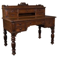 an old wooden desk with drawers on the top and one drawer at the bottom, sitting in front of a white background