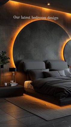 a large bed sitting in a bedroom next to a wall with lights on it's sides