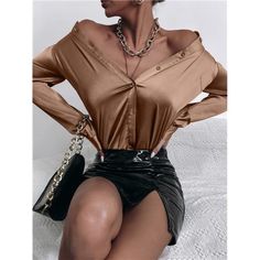 Elevate Your Wardrobe With Our Sophisticated Mocha Brown Satin Shirt, Perfect For Adding A Touch Of Elegance To Any Ensemble. With Its Classic Collar Neckline And Long Sleeves, This Shirt Exudes Timeless Charm And Refinement. Crafted From Luxurious Satin Like Fabric, This Shirt Offers A Smooth And Lustrous Texture, Making It An Ideal Choice For Elegant Occasions. The Button Detailing Adds A Polished Finish, While The Regular Fit Ensures A Flattering Silhouette. Designed With Versatility In Mind, Brown Satin Shirt, Brown Satin, Mocha Brown, Satin Shirt, Professional Look, Button Front Shirt, Tailored Trousers, Relaxed Style, Fashion Online Shop