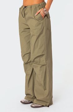 A baggy, Y2K-inspired fit gives you room to move in these lightweight, stretch-kissed cotton pants featuring utilitarian drawcords and cargo pockets. Drawcord-toggle waist Front slant flap pockets; back flap patch pockets; cargo flap-patch pockets Drawcord-toggle cuffs 95% cotton, 5% spandex Machine wash, dry flat Imported Cargo Baggy Pants, Cargo Parachute Pants, Visionary Fashion, Baggy Cargo Pants, Swimwear Dress, Cotton Pants, S Models, Model Height, Pacsun