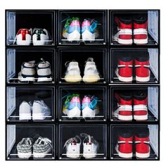 the shoe rack is filled with many pairs of baby's shoes, including red and white sneakers