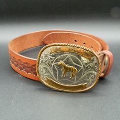 "Vintage German Silver engraved horse rodeo buckle with floral design. Shows some signs of wear especially on the gold areas but I think most of that could be buffed out. Includes a 28\" Bason leather belt, that is engraved on the back with \"Benay\". Would make a great gift for a collector or rider. buckle measures 3.75\" x 2.825\"" Horse Rodeo, Silver Horse, German Silver, Suspender Belt, Rodeo, Belt Buckles, Leather Belt, Floral Design, Etsy Accessories