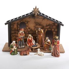 a nativity scene with figurines of the birth of jesus