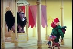 there is a cartoon scene with animals and people in the room, one has a princess on her back