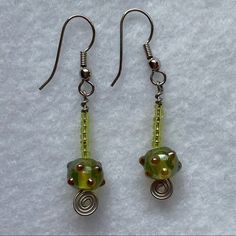 the earrings are made with glass beads