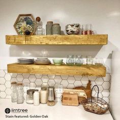 two wooden shelves above a sink in a bathroom