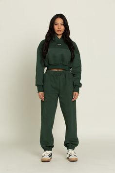 Elevate your athleisure style and feel like you're lounging on the go with our Hunter Green GH Jogger Sweatpants. The elastic waistband and tapered leg style allows you to feel secure and trendy. Complete with dual side pockets to keep your essentials close by. Pair with ur Hunter Green GH Cropped Hoodie to complete the set. Casual Green Sweatpants With Elastic Side Panels, Sporty Pants With Elastic Cuffs And Relaxed Fit, Sporty Green Pants With Elastic Side Panels, Athleisure Sweatpants With Ribbed Waistband, Sporty Sweatpants With Elastic Cuffs For Leisure, Sporty Joggers With Elastic Side Panels For Leisure, Sporty Loungewear Pants With Ribbed Waistband, Sportswear Joggers With Elastic Cuffs For Leisure, Sporty Lounge Pants With Ribbed Waistband