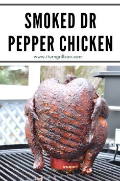 a cooked chicken sitting on top of a grill with the words smoked dr pepper chicken