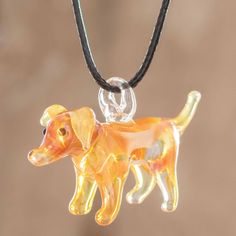 This delightful pendant necklace is designed by artisan Angel Castellanos in Costa Rica. The handmade art glass dog pendant in swirling shades of yellow and orange centers an adjustable waxed cotton cord. Glass Accessories, Art Glass Jewelry, Angel Necklace, Dog Pendant, Imperial Glass, Glass Pendant Necklace, Glass Animals, Golden Dog, Fun At Work