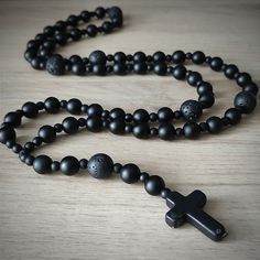 "Necklace Lengths: 26\" + 4\" pendant MATERIALS: - 8mm Black Matte Onyx Beads - 4mm Black Matte Onyx Beads - 10mm Lava Beads - 25mm Black Howlite Cross Beads - Black Nylon Cord ADDITIONAL INFORMATION: - Knotted Closure Estimated shipping times United States: 3-5 weeks North America: 3-5 weeks Europe: 9-18 business days I'll do my best to meet these shipping estimates, but cannot guarantee them." Adjustable Cross Necklace With 8mm Beads, Black Spiritual Jewelry For Father's Day, Spiritual Black Jewelry For Father's Day, Adjustable Cross Necklace With 108 Beads, Cross Necklace Mens, Necklace Mens, Gift Boyfriend, Necklace Cross, Mens Necklace