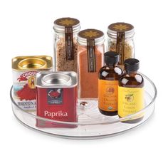 spices and condiments are arranged on a clear tray