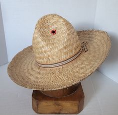 If your looking for something to keep you cool this summer, here's a unique vintage straw hat. Perhaps a garden hat. You don't get more Western than this cool straw Cowboy ~ Cowgirl hat. Tall crown wide brim to keep the rays off your head and stay protected.  Please note this is two of three hats but this doesn't have the original tag, however there is a photo example of the original, Famous Sun Shade tag. Manufactured by the Mexican American Hat Company St Louis, MO. Label reads: This is the famous Sun Shade Adjustable  Hat, hat with headsize control, U.S. Pat 1 672 217, which dates to 1929. Condition: Appears to be in unworn, NOS, new old stock, Deadstock condition. Please view photos as they are part of the description.  Size: Measures out to a 6 7/8 Buyer pays all related USPS Priority Retro Summer Hats For Country Events, Vintage Adjustable Sun Hat For Rodeo, Vintage Adjustable Hat Bands For Vacation, Vintage Summer Straw Hat For Rodeo, Retro Adjustable Straw Hat For Vacation, Adjustable Retro Straw Hat For Vacation, Retro Summer Vacation Straw Hat, Retro Curved Brim Straw Hat For Beach, Retro Wide Brim Straw Hat For Beach