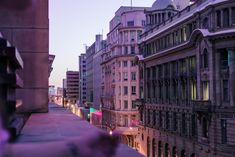 a city street filled with lots of tall buildings