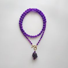 < Long glass beaded necklace with amethyst stone pendant > Very original and elegant combination. The stone is natural amethyst. Amethyst is the stone of St. Valentine and faithful love. It carries the energy of fire and passion, creativity and spirituality. This necklace can be beautiful accent to any look! > Necklace length - 89 cm (35 in) > Necklace weigth - 78 gm V Necklace, Red Coral Necklace, Coral Beads Necklace, St Valentine, Necklace Amethyst, Bead Choker, Necklace Purple, Purple Necklace, Red Jewelry