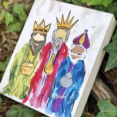 an image of three wise men with crowns on their heads and one wearing a crown