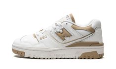 The Women’s New Balance 550 “White/Beige” is a women’s-exclusive colorway of the retro basketball shoe with a versatile design.  The women’s 550 in “White/Beige” features a white leather design with contrasting beige leather “N” branding on the sides and beige leather overlays on the collar and beige mesh on the tongue.  Other beige detailing can be found on the “NB” logo on the heel and on the “New Balance 550” logo on the tongue tag.  A white rubber midsole and white and beige rubber outsole c New Balance 550 White And Beige, Drippy Shoes, New Balance Beige, Nb Logo, Designer Things, Retro Running Shoes, Sneakers Box, New Balance White, Concert Fit