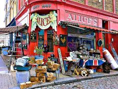 a red building with lots of items in front of it