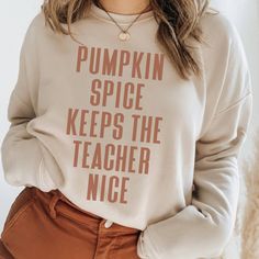 Cute Fall Shirts for teachers, Teacher Costume, Aesthetic Autumn Apparel, Halloween Teacher Sweatshirt, Teacher Appreciation Gift, Cool Weather Tshirts for Moms and Fall Tees get 20% OFF NOW! Login for Extra Discounts! The Perfect Shirt for Fall! Get $5 OFF NOW! bit.ly/x3sass5offnow Love the design, but want to browse other beautifully soft tees for your wardrobe? We are constantly adding new designs! Follow me... www.x3sass.etsy.com These t-shirts are likely to become your new favorite! Super s Cute Fall Teacher Shirts, Teacher Thanksgiving Shirts, Teacher Fall Shirts, Funny Long Sleeve T-shirt For Fall, Cute Text Print Sweatshirt For Fall, Funny Cotton Tops For Fall, Thanksgiving Sweatshirt Ideas, Funny Long Sleeve Tops For Fall, White Tops With Funny Text For Fall