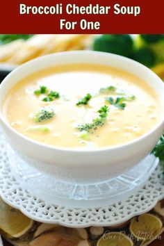 broccoli cheddar soup for one in a white bowl on a plate