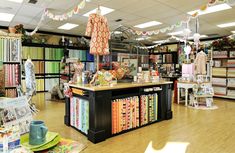 the inside of a store with many items on display