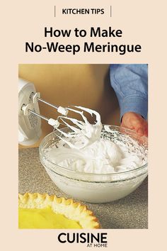 a person mixing food in a bowl with a whisk