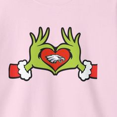 a pink t - shirt with two hands holding a heart